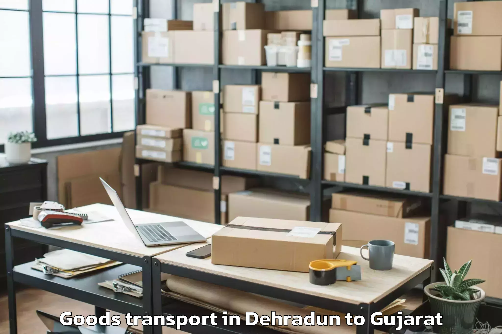 Top Dehradun to Khambhaliya Goods Transport Available